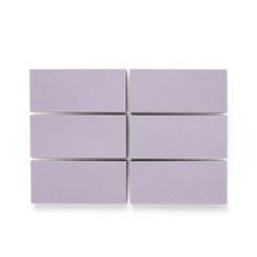 four square purple tiles on a white background