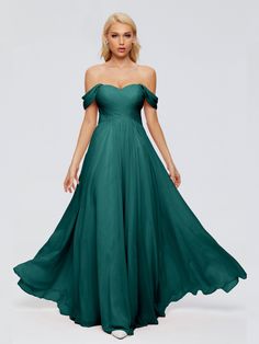 a woman in a long green dress