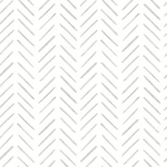 a white and gray herringbone pattern with diagonal lines on it's surface, as well as the background