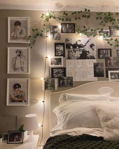 a white bed topped with lots of pictures and lights