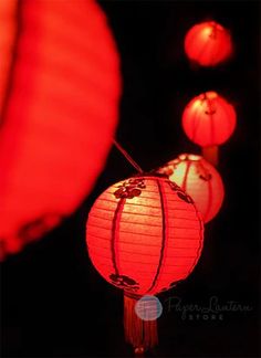 red lanterns are lit up in the dark