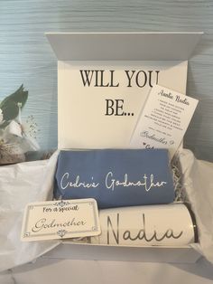 a gift box with congratulations cards and other items in it that say, will you be?