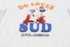 Dolce & Gabbana Gorgeous brand new with tags, 100% Authentic Dolce & Gabbana t-shirt. Model: Crew Neck T-shirt short sleeve top Material: 100% Cotton Motive: DG LOVES SUD Color: White with multicolor print Logo details Made in Italy Casual Luxury, White Crew Neck, Shirt Model, Dolce E Gabbana, Dolce & Gabbana, Print Logo, Crew Neck Tee, Casual Boots, Leather Accessories