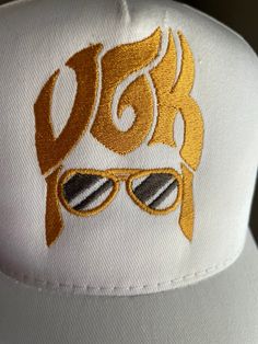 Quantities are limited so get them while available.  Vegas Golden Knights ELVIS hat/cap is finished in snapback style. Embroidered with commercial grade brilliant metallic threads Abailable in either Black, or White cap color. Please message me your color choice. Our unique embroidered designs are created with the utmost attention to details. They are NOT made in Mexico, or China they are proudly MADE IN AMERICA 🇺🇸 Summer Gold Trucker Hat, Adjustable Gold Baseball Cap For Summer, Gold Adjustable Trucker Hat For Summer, Adjustable Gold Trucker Hat For Summer, Gold Baseball Cap For Summer, Gold Casual Trucker Hat, Gold Casual Trucker Hat One Size, Casual Gold Trucker Hat One Size, Gold Casual Trucker Hat, One Size Fits Most