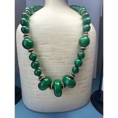 A vintage emerald-green beaded necklace is a striking piece of jewelry characterized by its vibrant, deep green beads. This necklace exudes an air of elegance and sophistication, with the rich green color evoking a sense of luxury. Size: Womens 26" Condition: New Without Tags Excellent Condition. Green Single Strand Necklace For Formal Occasions, Elegant Green Single Strand Necklace, Single Strand Emerald Necklace For Formal Occasions, Elegant Single Strand Green Emerald Necklace, Green Polished Beads Necklace For Party, Elegant Green Round Beaded Necklace, Elegant Green Round Beaded Necklaces, Classic Green Single Strand Necklace, Green Round Beaded Necklaces For Party