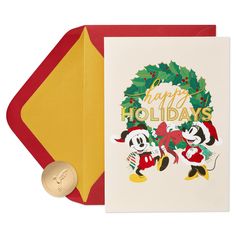 a christmas card with two mickey mouses and a gold medal on top of it