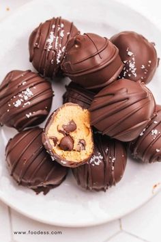 chocolate covered peanut butter balls on a white plate