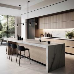 a modern kitchen with marble counter tops and bar stools next to the island in front of it