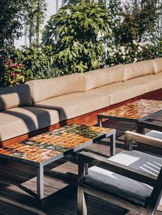 a couch and table on a wooden deck