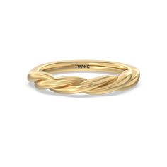 a yellow gold ring with an intertwined design