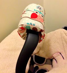 a hair dryer sitting on top of a pile of towels next to a wall