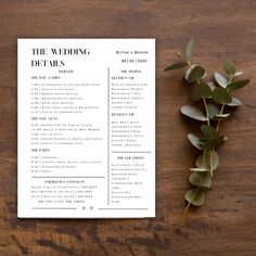 a wedding program on top of a wooden table next to eucalyptus leaves and a flower