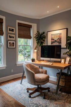 a home office with a desk, chair and computer on top of a rug in front of two windows