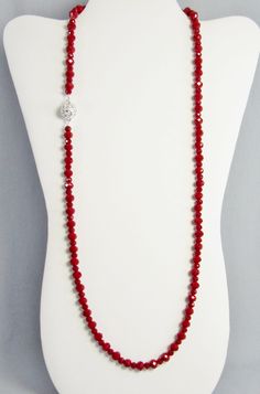 Opaque with sparkle, these red crystal beads are easy to wear and striking! The crystal rondelle beads are small to medium size with plenty of facets to reflect the light. Slip it on over your head or use the beautiful rhinestone magnetic clasp. It is 30 inches long (76 cm) and lightweight enough to layer with other necklaces. It is made with 4mmx6mm and 6mmx8mm beads. This necklace and all KBeadsIt jewelry ship fast and free with USPS first class domestic package service. The black, silver, and Red Faceted Rondelle Beaded Necklaces, Adjustable Red Crystal Necklace With Gemstone Beads, Red Rondelle Beaded Necklace, Single Strand, Red Rondelle Single Strand Beaded Necklace, Red Rondelle Beaded Necklace Single Strand, Red Crystal Beaded Necklaces With Round Beads, Red Crystal Necklaces With Faceted Beads For Jewelry Making, Red Crystal Beaded Necklace With Round Beads, Red Rondelle Beaded Necklace With Spacer Beads