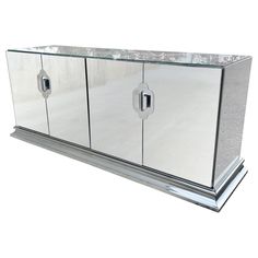 a large mirrored cabinet with two doors on each side