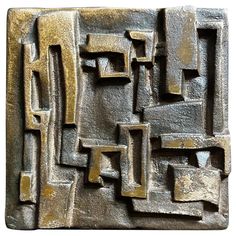 an abstract metal design with square and rectangle shapes