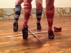 two people wearing socks and argyle socks standing next to each other on a hard wood floor