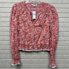 This Blouse Is So Cute That It Might Actually Make Flowers Jealous. Be The Garden Party Wherever You Go! Floral Print Lace Trim Long Sleeves With Shirred Cuffs Smocked Yoke V-Neckline Lightweight Fabric Elastic Waist Size: Womens Xs Condition: New With Tags Features: Boho Spring Red Blouse With Blouson Sleeves, Long Sleeve Peasant Top With Floral Print For Spring, Spring Long Sleeve Peasant Top With Smocked Bodice, Long Sleeve Floral Print Peasant Top For Spring, Long Sleeve Peasant Top With Smocked Bodice For Spring, Bohemian Long Sleeve Blouse With Ditsy Floral Print, Red Long-sleeve Peasant Top For Spring, Spring Floral Print Peasant Top, Bohemian Peasant Top With Puff Sleeves And Floral Print