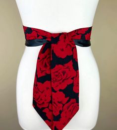 Wide Red Rose Sash Belt  Reverses to Solid Black Sash  Black & Red Sash  Red and Black Floral Sash  Red Floral, Red Rose Belt  Satin Swank  Instantly update your jeans, dress, or top with the Satin Swank® reversible waist sash. Depending on your waist size and the length you choose (60, 75, and 90 inch lengths available), you can wrap this sash around your waist once or twice. You decide whether to tie the sash in a bow or a simple knot with long-hanging tails. Tie in front, in back, or on the side. Vivid red rose on black print in poly peachskin on one side, and your choice of solid red or solid black charmeuse satin on the reverse side make this sash the ultimate 2-in-1 accessory to expand your wardrobe. Enter your reverse side color choice using the drop down menu. SIZING/COLOR/PRINT IN Fabric Reference, Rose Belt, Floral Sash, Draping Fabric, Waist Sash, Sash Belts, Sash Belt, Solid Red, Suspender Belt