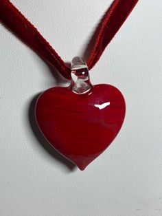 Choker, wrap, necklace, made with a red heart shaped Murano inspired glass pendant pendant width 1 3/16 inches / 3 cm pendant height 1 1/2 inches / 3.75 cm comes with a red velvet wrap choker, clavicle cord 17-18.5 inches / 43-47 cm will be shipped in a gift bag this item makes such a unique gift with the red velvet wrap cord perfect gift for birthdays, Valentines, Christmas, Easter or any occasion Please have a look at the other items in my store. I ship all multi-item purchases in the same pac Wrap Necklace, Pendant Choker, Pretty Necklaces, Small Cards, Glass Pendant, Red Heart, Glass Pendants, Beautiful Necklaces, Red Velvet