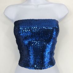 This Royal Blue Sequin Strapless Tube Top is made with high quality sequins on the outside, as well as polyester on the inside. The size of the tube top is 12 inches wide and 10 inches tall when flat. It is also stretchy and form fitting as well. If you have any questions about our products or have any inquiries please contact us and I will be glad to help. *Since this item is hand-made, the design can vary slightly from the image. Cheap Purple Strapless Tube Top, Blue Sequin Fabric For Summer Night Out, Strapless Sequin Party Tops, Strapless Sequin Tops For Parties, Strapless Sequin Tops For Party Season, Evening Blue Bandeau Tube Top, Blue Bandeau Tube Top For Evening, Strapless Sequin Top For Night Out, Summer Sequined Bandeau Tops