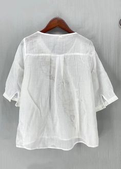 New White Embroideried Button Side Open Linen Shirt Half SleeveFabric: Cotton 45%, Linen 55%Size & Fit: Fit: This garment fits true to size.Length: Size L measures 24.57"from shoulder to hemBust: Great for any cup size. Waist: Loose Fit. Comfortable room throughout midsection.Hip: Loose Fit - room for hips. Hand Wash Cold. White Half Sleeve Blouse With Buttons, Relaxed Fit Half Sleeve Top With Buttons, Relaxed Fit Half-sleeve Tops With Buttons, White Half Sleeve Top With Button Closure, Half Sleeve Cotton Tops With Buttons, White Half Sleeve Top For Daywear, Cotton Tops With Placket And Half Sleeve, Cotton Half Sleeve Tops With Placket, White V-neck Top With Placket