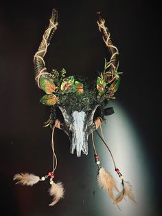 woodland spirit headdress Faux ram skull headdress with leaves and moss and white line in middle. Perfect for samhain festivals and pagan rituals! I N C L U D E D Masks come with thick black elastic band attached. S I Z E  Adult size. Detailed dimensions available upon request. C U S T O M I Z A T I O N If you would like to color & embellish the mask to match your costume/dress, choose custom color and get in touch, we love to work on custom orders!  C O N T A C T  Please contact us via ETSY messages. P H O T O  Images displayed on this listing are property of www.higginscreek.com A B O U T HigginsCreek makes elegant face Masks for masquerade balls, Prom Dances, Bachelorette parties, Graduation, costume Birthdays, Halloween, musical & theater productions, Mardi Gras celebration and Carniva Forest Headdress, Viking Headdress, Samhain Festival, Skull Headdress, Kids Party Packs, Elegant Face Mask, Scary Halloween Masks, Thank You Wishes, Ram Skull