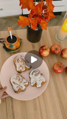 an image of some food on a plate with apples and oranges in the background