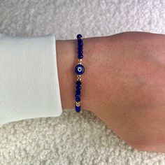 Protect yourself from negativity with our blue evil eye bead bracelet with gold balls and bring only positive vibes into your life. Since all of our Nazar protective bracelets with the popular Turkish eye are adjustable in size, they fit children, women and men and are therefore the perfect gift. What are the advantages of our 100% handmade blue protective amulet? ❤️ Unique Hamsa or Boncuk design. ❤️ Uniquely braided and therefore suitable for every wrist. ❤️ Many color variations and therefore Gold Evil Eye Bracelet With Letter And Round Beads, Spiritual Blue Stretch Bracelet With Letter Beads, Blue Spiritual Healing Friendship Bracelets, Blue Evil Eye Bracelet With Round Beads, Healing Beaded Evil Eye Bracelet With Round Beads, Blue Beaded Evil Eye Bracelet For Friendship, Gold Hand-strung Evil Eye Bracelet For Friendship, Healing Beaded Evil Eye Bracelet, Healing Evil Eye Beaded Bracelet