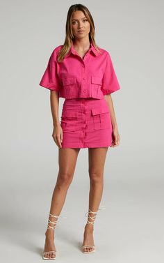 Navine Button Front Crop Top and Cargo Pocket Mini Skirt Two Piece Set in Hot Pink | Showpo USA Trendy Summer Cropped Shirt With Pockets, Trendy Cropped Shirt With Pockets For Summer, Summer Workwear Button-up Mini Skirt, Summer Button-up Skort, Summer Button-up Mini Skirt, Button-up Mini Skirt For Summer, Summer Cropped Short Sleeve Shirt For Day Out, Summer Cropped Shirt With Short Sleeves For Day Out, Trendy Cropped Short Sleeve Shirt With Buttons