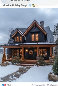 a black and white house with christmas lights on it