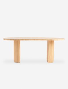 an oval wooden table with two legs on the top and one leg extended to the side