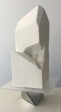 a white sculpture sitting on top of a table