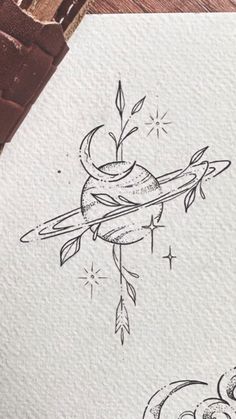 an ink drawing of a bird on top of a piece of paper