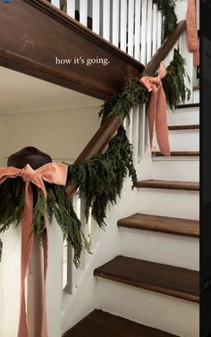 the stairs are decorated with garland and bows