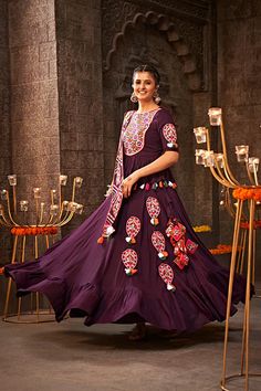 Shubhkala Purple Thread Embroidered Designer Traditonal Navratri Collection Elevate your Navratri celebrations with the exquisite Shubhkala Purple Thread Embroidered Designer Traditional Collection. This collection features intricate purple thread embroidery that adds a touch of elegance and tradition to your festive attire. Perfect for showcasing your style and celebrating the vibrant festival in high fashion. Key Features Rich purple thread embroidery detailing Designer traditional design for Purple Floor-length Traditional Wear For Navratri, Festivals Semi-stitched Sharara With Motifs, Traditional Wear With Motifs For Puja During Navratri, Embroidered Art Silk Anarkali Set For Navratri, Art Silk Traditional Wear For Navratri, Purple Dori Work Kurta For Festivals, Navratri Purple Sharara With Cutdana, Purple Dupatta With Dori Work For Navratri, Traditional Dola Silk Choli For Navratri