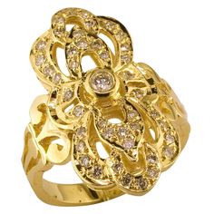 S.Georgios Hand Made 18 Karat Yellow Gold Long Ring decorated with Byzantine-era style workmanship and features Brilliant cut Diamonds total weight of 0.58 Carat. We also make this gorgeous design in White or Rose Gold, and with different colored precious stones, please contact us. The stunning ring is outstanding in the quality of workmanship and stone collection and is made in our workshop in Athens Greece. Length: 27.0 mm Weight: 8.10 grams Size 7 1/2 (can be custom-sized to fit any desired s Black Rhodium Ring, Emerald Band Ring, Byzantine Rings, Byzantine Jewelry, White Gold Diamond Band, Long Ring, Gold Diamond Band, Diamond Bangles Bracelet, Diamond Cocktail Rings