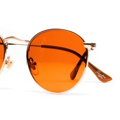 Frame Style Highlights: Gender: Unisex Frame: Gold Metal Wireframe Lens Color: Orange UV Rating: UV400 Fit / Size: Small - Medium In the Box: Sunglasses & Microfiber Pouch Lens Width: 50mmLens Height: 45mmBridge Width: 15mmArm Length: 125mm Modern Orange Cat Eye Sunglasses With Mirrored Lenses, Orange Wayfarer Sunglasses With Anti-reflective Coating, Orange Anti-reflective Sunglasses For The Beach, Orange Anti-reflective Sunglasses For Beach, Orange Shield Sunglasses With Uv Protection For Summer, Orange Sunglasses With Gradient Lenses For Beach, Orange Sunglasses With Uva Protection For Beach, Trendy Orange Sunglasses With Polarized Lenses, Orange Gradient Lens Sunglasses For Beach