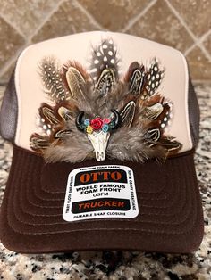 Feathered Trucker Hat. Each feather individually placed by hand on the hat, therefore all hat designs and patterns will vary, making each hat unique and 1 of a kind! **WARNINGS** *Keep away from children and pets. The Freshiry is NOT RESPONSIBLE for any damages or injuries due to misuse. SOCIALS: Add our shop to your favorites!  Follow us on our FB, Instagram and TikTok pages @the_freshiry for updates on new products! POLICIES: All products are FINAL sale, but should you have an issue, please contact us within 2 days of delivery of your order and I will do my best to resolve it. Note: Products are handmade and may have slight imperfections.  The Freshiry is NOT RESPONSIBLE for any damages or injuries due to misuse. To view our entire policies, please click here: https://www.etsy.com/shop/t Western Snapback Trucker Hat For Ranch, Western Snapback Hat For Ranch, Western Style Adjustable Trucker Hat For Ranch, Country Style Baseball Cap For Western Events, Country Style Baseball Cap For Western-themed Events, Adjustable Western Trucker Hat For Ranch, Western Style Trucker Hat For Beach, Western Beach Trucker Hat, Adjustable Trucker Hat For Ranch