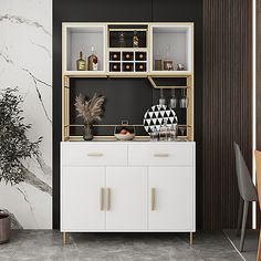 a white cabinet with gold handles in a black and white dining room, next to a potted plant