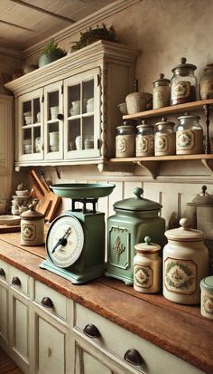 an old fashioned kitchen has many jars and containers on the counter top, along with a clock