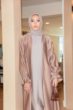 Introducing our silkiest abaya, Malika (Queen) made specifically to remind you of your own divine beauty. The intricate beadwork lining the delicately-pleated waist and sleeves gives depth and dimension to this modest silhouette. Both sleeves feature a tie at the wrist to prevent any of your arm showing whilst moving around or praying. Includes plain slip and matching hijab (clothing shown in images were styled for shoot purposes only). Divine Beauty, British Indian, Bead Work, Chiffon, Queen, Beauty, Clothes