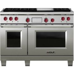 an oven with four burners and two doors on each side, in stainless steel