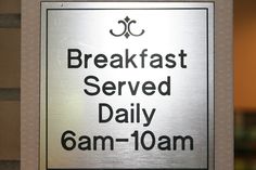 a sign that says breakfast served daily 6am - 10am