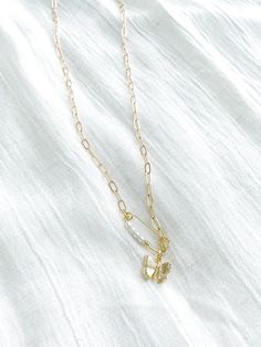 Gold plated pendants. Gold plated paperclip chain. 18.5" in length Trendy Dangle Necklace With Lobster Clasp, Dainty Pendant Charm Necklaces, Paperclip Necklace With Delicate Chain For Gift, Gold Plated Dangle Charm Necklaces With Chain, Gold-plated Dangle Charm Necklaces With Chain, Gold Plated Charm Necklaces With Paperclip Chain, Gold Charm Necklaces With Initial Pendant And Paperclip Chain, White Charm Necklace With Delicate Chain, White Metal Charm Necklace With Delicate Chain