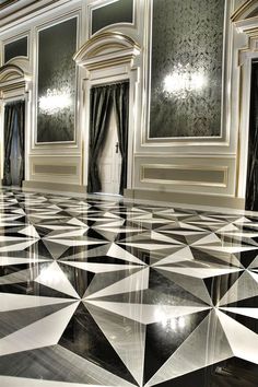 a room with black and white marble flooring