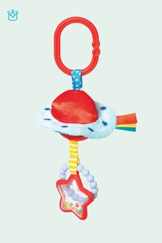 a red and blue toy with a star on it's back hanging from a hook