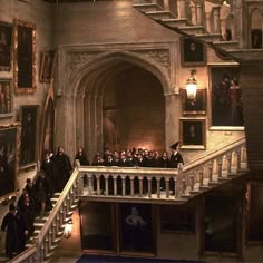 a group of people standing on top of a staircase