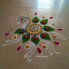 an artistic design on the floor with colorful colors and beads in it's center