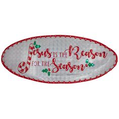 a white and red oval platter with the words pass us the reason for the season